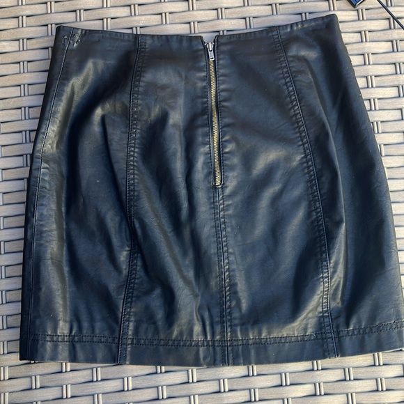 Free People faux leather mini skirt.  Fully lined.  Zips in the back.  Cute on! - Picture 2 of 9